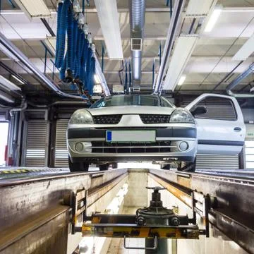 Low angle view of small urban personal car at service station at car repair Foto stock