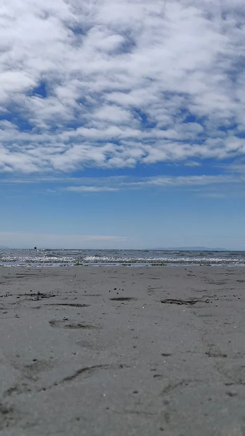 Low Angle View of Small Waves on the Beach Stock Footage 168906013