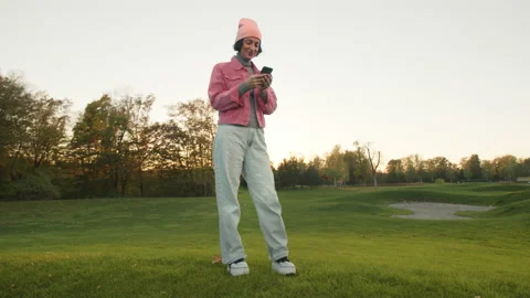 Low angle view of a smiling, cheerful girl in her 30s Stock Footage 221321612
