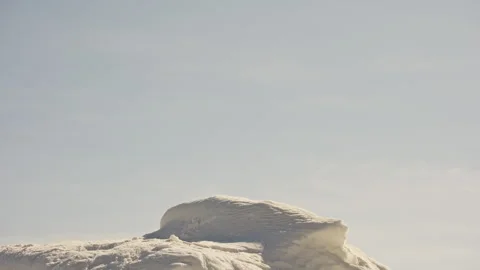 Low Angle View of Snow Pile with Warm Sunlight Видео 326386888