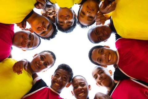 Low angle view of soccer team in circle Stock Photos