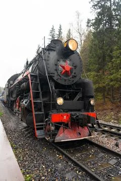 Low-angle view of a Soviet-era steam locomotive front Stock Photos
