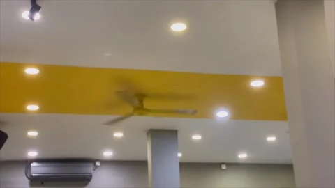 Low angle view of spinning ceiling fan 스톡 동영상 334949879