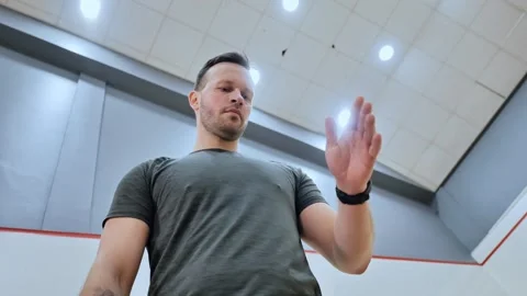 Low Angle View of Squash Player Bouncing Ball on Court in Slow Motion, Europe Stock Footage 309187215