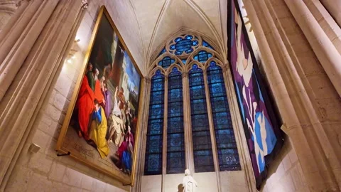 Low-angle view of Stained glass windows interior of Notre-Dame de Paris after Stock Footage 307184155