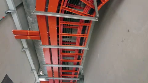 Low angle view of steel electrical cable trunking box hang on the ceiling. Sl Video stock 154803664