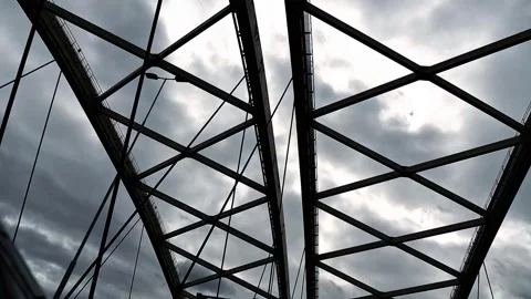 Low angle view of steel truss bridge with intersecting beams Stock Footage 319403042