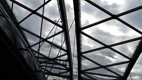 Low angle view of steel truss bridge with intersecting beams Stock Footage 319403239