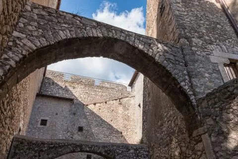 Low angle view of stone castle arches and walls from an inside courtyard. 스톡 사진