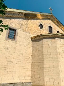 Low angle view of the stone wall exterior of The Church Dormition of the Mother  Stock Photos
