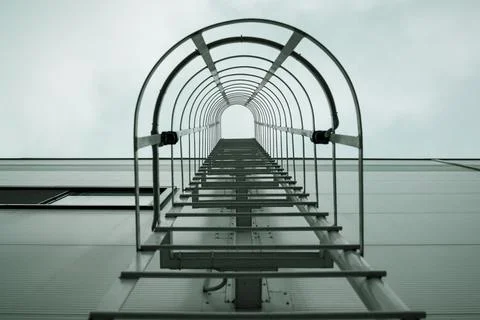 Low angle view of store building with the fire escape. Stock Photos