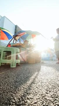 Low angle view. A street culinary vendor in city square Stock Photos