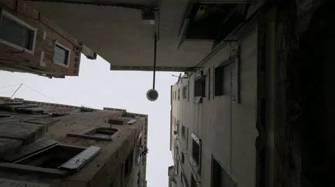Low angle view of a street with old buildings and old street lamp, Venice Stock Footage 58846673
