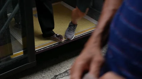 Low angle view to the street road at bus stop close up to bus doors while p.. Stock-Footage 246469572