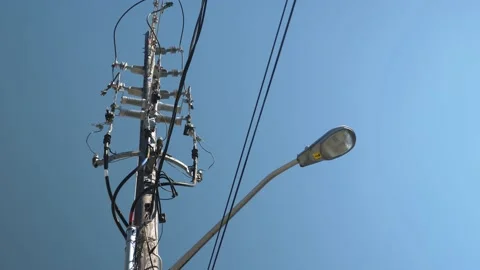 Low angle view of streetlight, electric wires and insulators. Toronto. Stock Footage 169034550