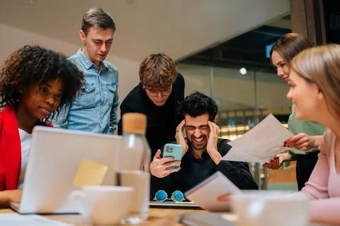 Low-angle view of stressed overwhelmed businessman feeling tired at corporate Stock Photos