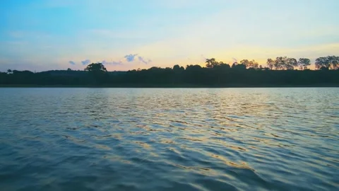 Low angle view of a sunset at Ibiúna dam Stock Footage 139060043