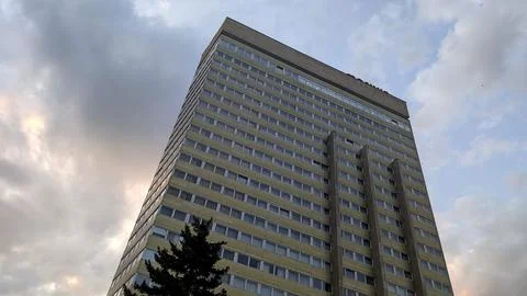 Low-angle view of a tall high-rise building with a repetitive window grid, ph Stock Photos