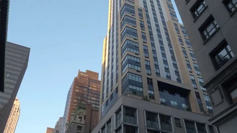 LOW ANGLE VIEW: Tall office buildings and blocks of flats in New York City Stock Footage 72096378