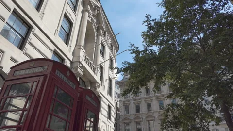 Low angle view of telephone booths and old buildings. London. Stock Footage 91958380