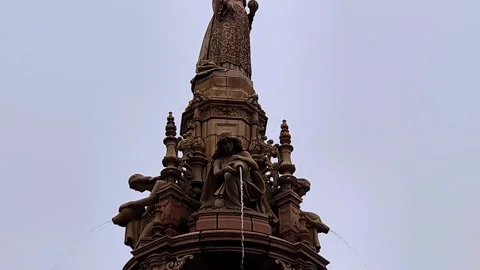 Low angle view of terracotta figure pouring water from a jug Stock Footage 164057522