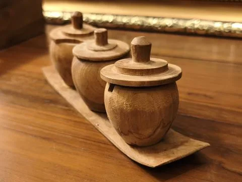 Low angle view of three turned wooden tea containers 写真素材