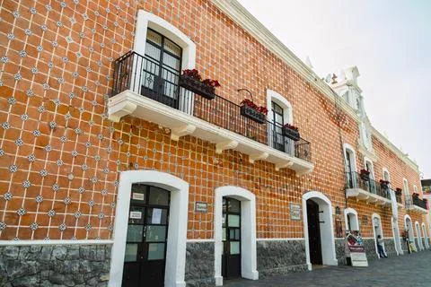 Low angle view of tiled town hall facade with treasury entrance and balcony Stock Photos