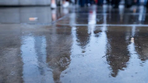 Low angle view timelapse of commuters walking in the rain at rush hour Video stock 118238427