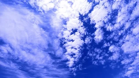 Low Angle view TimeLapse of direct bright noon sun on blue sky with clouds, s 動画素材 158372793
