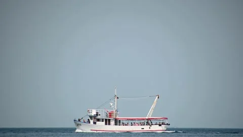 Low angle view of tourist boat passing by Stock Footage 159017557
