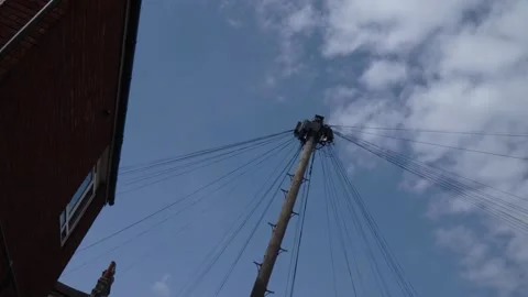 Low-Angle View Up Towards Power Lines in a Neighborhood Stock-Footage 335076741