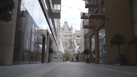 A low angle view of the Tower Bridge between buildings. Stock Footage 142799935