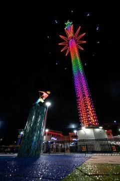 Low-Angle View of Tower Ride and Diver Statue at Night Stock Photos