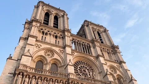 Low angle view of towers of Notre Dame Cathedral against blue sky Stock Footage 340863190