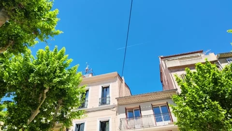 Low Angle View of Traditional Architecture and Trees in Cassis France Vídeos de archivo 335195011