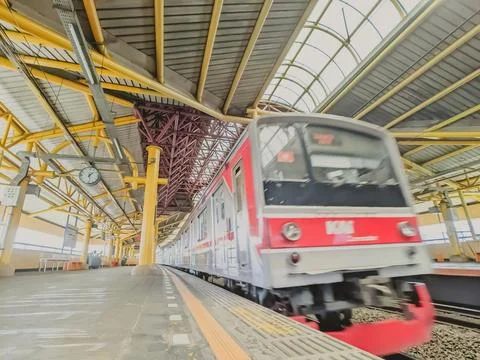 Low angle view of a train passes station platform Stock Photos