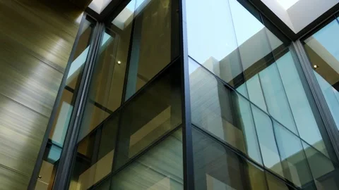 Low angle view of transparent glass wall of luxury hi-tech villa. Minimalist Stock Footage 243517275