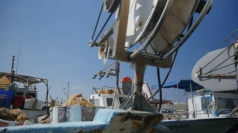 Low angle view of a trawl winch drum mounted on a fishing boat Stock Footage 114916698