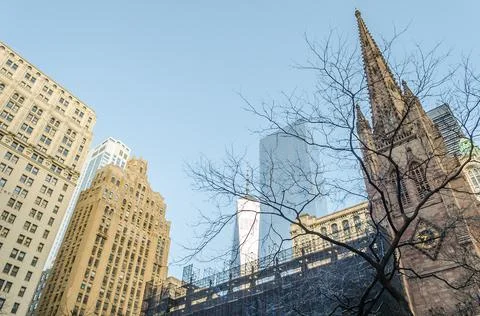 Low Angle View of Trinity Church Top and Other Skyscrapers in Wall Street, NYC Stock Photos