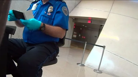 Low Angle View of TSA Agent Checking Passports at Airport Stock Footage