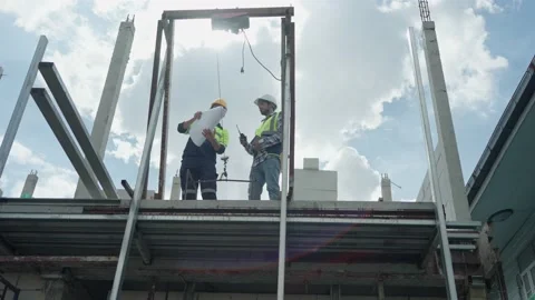 Low angle view, Two professional male civil engineer, inspector with contract Video stock 213996100
