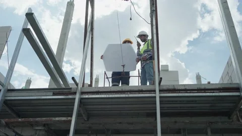 Low angle view, Two professional male civil engineer, inspector with contract Video stock 217749274