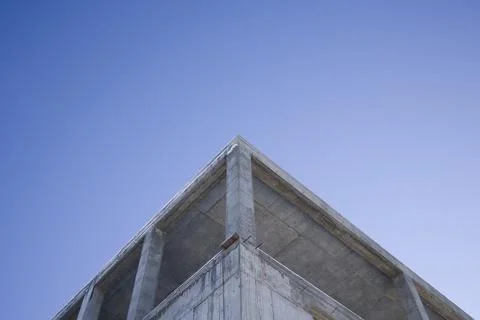 Low Angle View Of Unfinished Building Against Clear Blue Sky Stock Photos