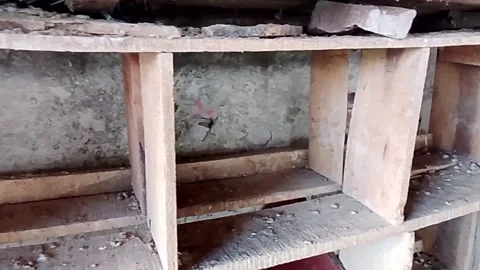Low angle view of an unfinished concrete building structure with exposed rebar Video stock 343553745