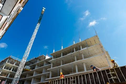 Low angle view on unfinished edifice, building under construction and tower.. Fotos de archivo