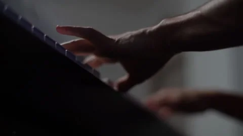 Low-angle view of unrecognizable musician man playing on synthesize at home Stock Footage 150040802