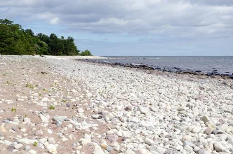 Low angle view from a untouched stony coast Stock Photos