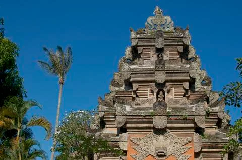 Low angle view on the upper part of the beautiful stone gate of Ubud Palace Stock Photos