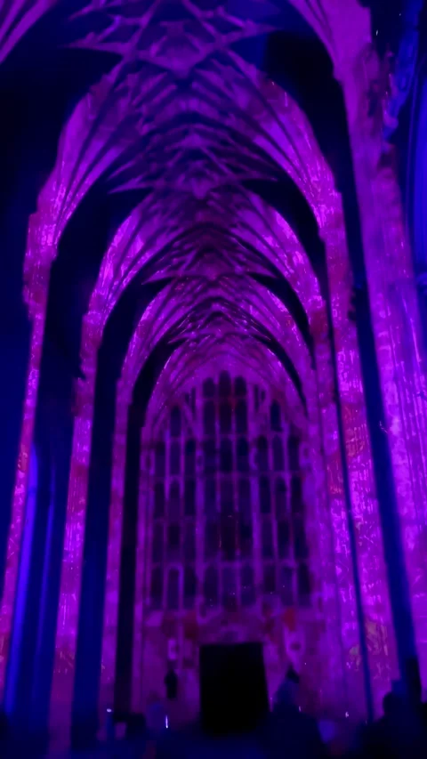 Low Angle View of Vibrant Light Installation Illuminating Gothic Arches Inside Stock Footage 346375187