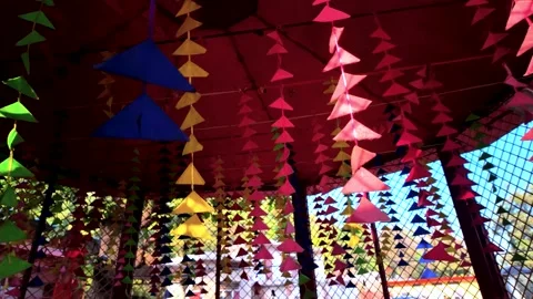 Low Angle View of Vibrant Paper Bunting Decorations Hanging in an Indian Temple Stock Footage 329798159